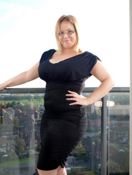 Getting nude: Overweight amateur Sindy Bust donnes the black dress.