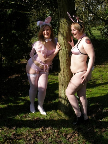 In a yard, amateur fatties expose their pet tits while wearing cosplay outfits.