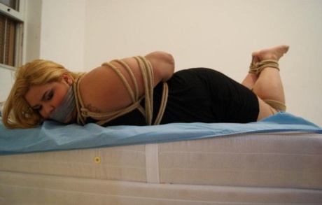 Strawberry Blonde Plumper Is Tied Up With Rope While Cleave Gagged