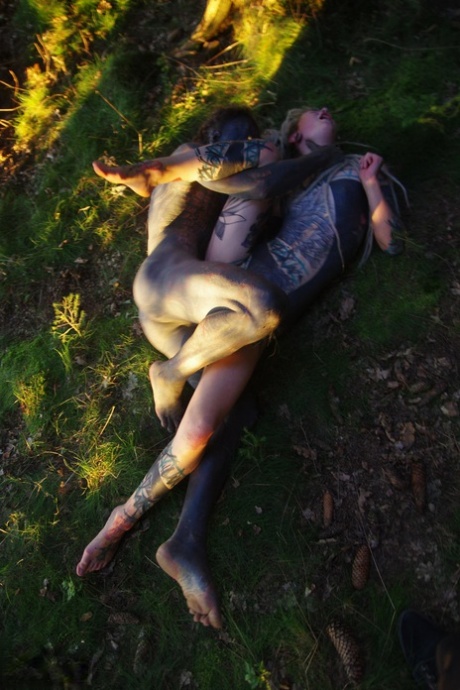In a forest setting, Anuskatzz and Lily Lu engage in sexual intercourse.