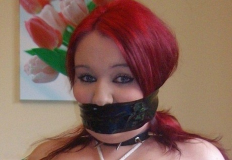 Redheaded Fatty Is Gagged After Having Her Tits Bound And Nipples Clamped