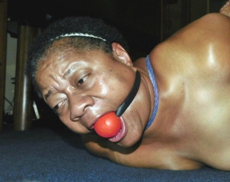 Overweight Black Woman Trixie Struggles Against A Ball Gag While Hogtied
