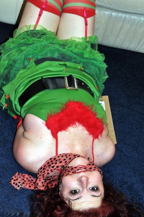 Busty Redhead Is Restrained And Gagged In Christmas Outfits