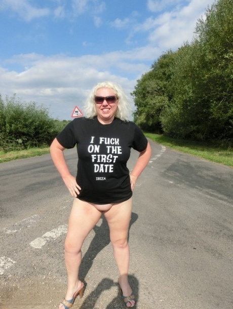 Aged platinum blonde Barby goes for a naked look on the road's side, dressed in various clothing styles.