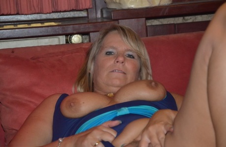 As she displays her breasts, Sweet Susi, a blonde amateur, wide-ranging in the leg opening.