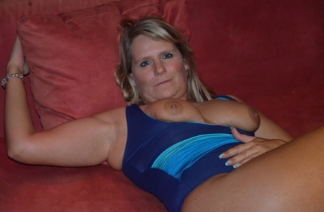 Despite being an amateur, Sweet Susi is a blonde who exhibitly flaunts her breasts while stretching her legs.