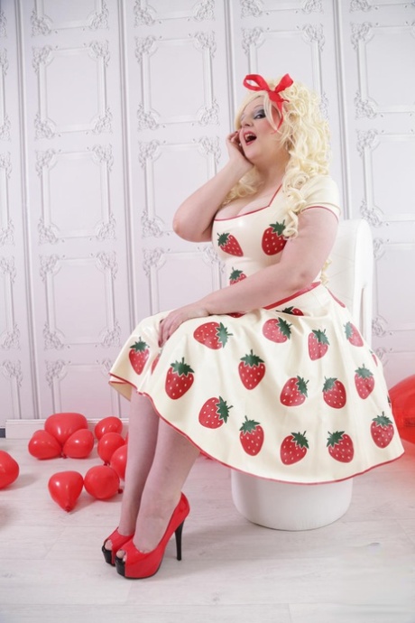 Thick Blonde Avengelique Models A Latex Dress In Hosiery And Red Heels
