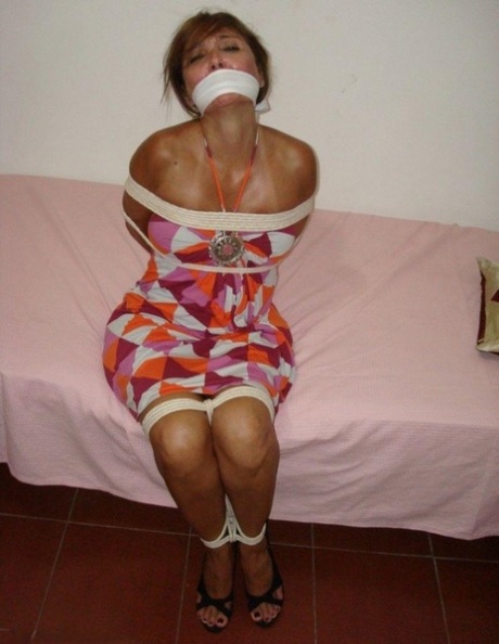 At the same time two girls are gagged while scuffling against rope restraints.