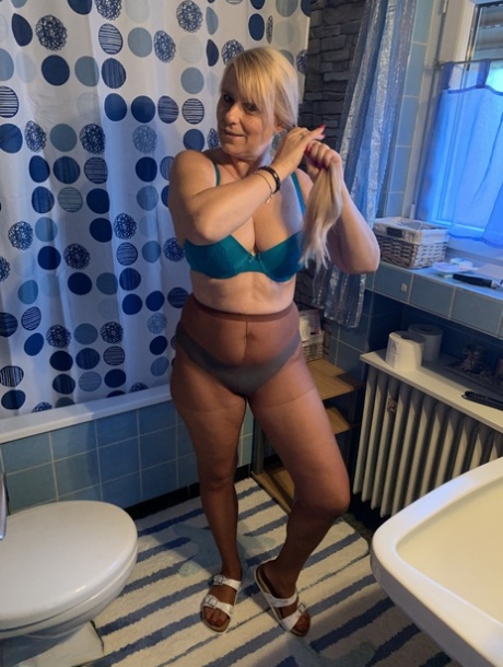Older Blonde Amateur Sweet Susi Gets Naked During Candid Action At Home