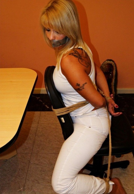 Blonde prostitute, tied to desk chair with duct tape and silenced.