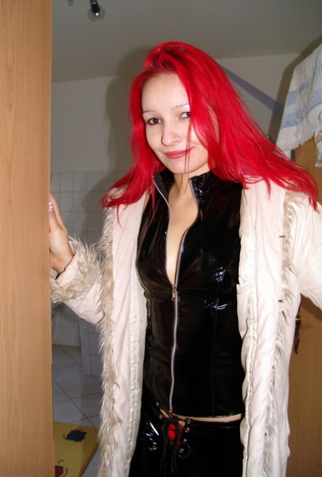 Solo girl with dyed hair Tkbaby practices self bondage in a home dungeon