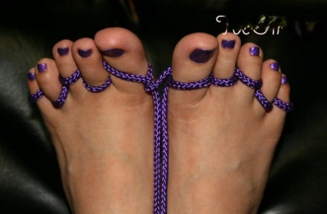 Girl With Pretty Feet Has Her Toes Tied Up With Rope Before Giving A Footjob