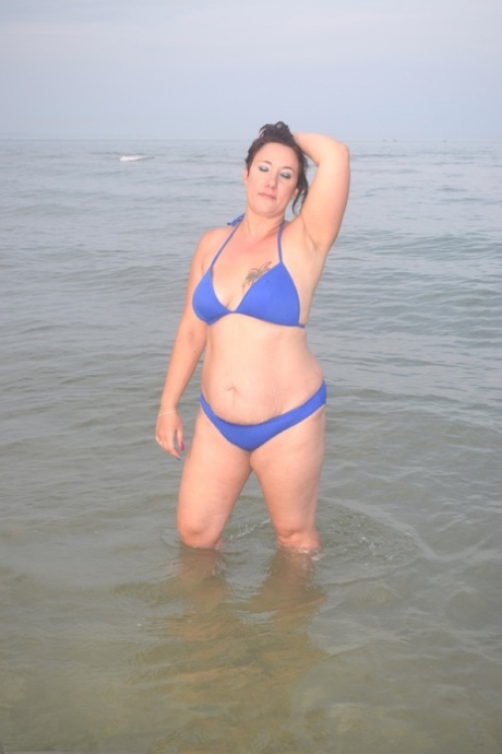 The beach is where an amateur, single girl, changes her attire while exposing herself at the end of the swim.