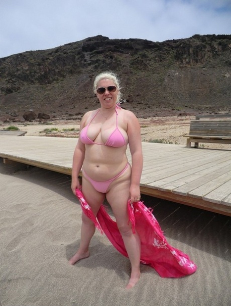 Barby, the older member of the platinum blonde family, reveals her plump figure at the seaside.