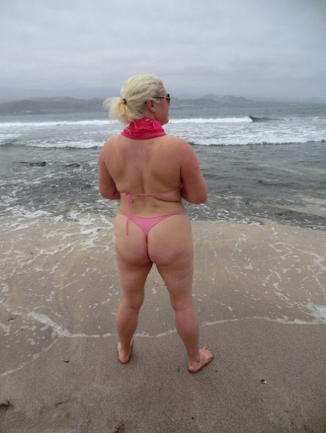 At the beach, Barby displays her plump figure as she flaunts her older platinum blonde locks.