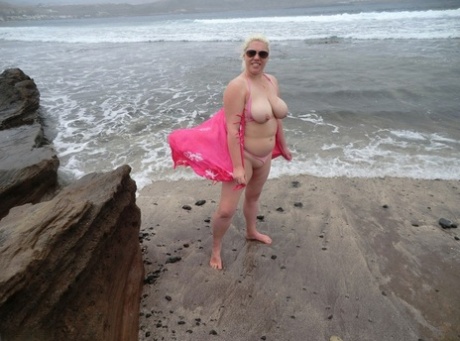 Barby, who is a platinum blonde with an older physique, flaunts her plump figure at the beach.