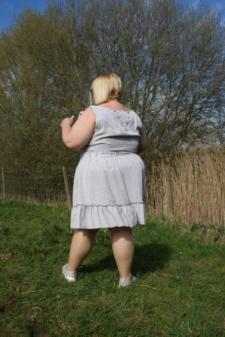 Obese UK blonde Lexie Cummings, wearing hosiery to masturbate in a field.