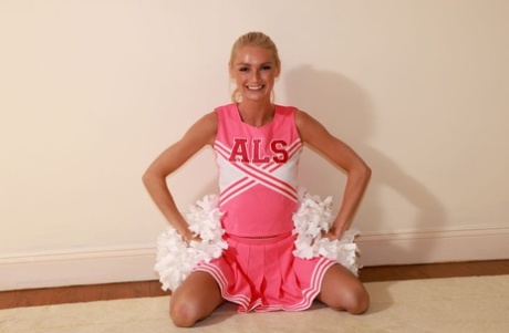 With her naked body exposed by the end, blonde cheerleader Payton Avery spreads her long legs.