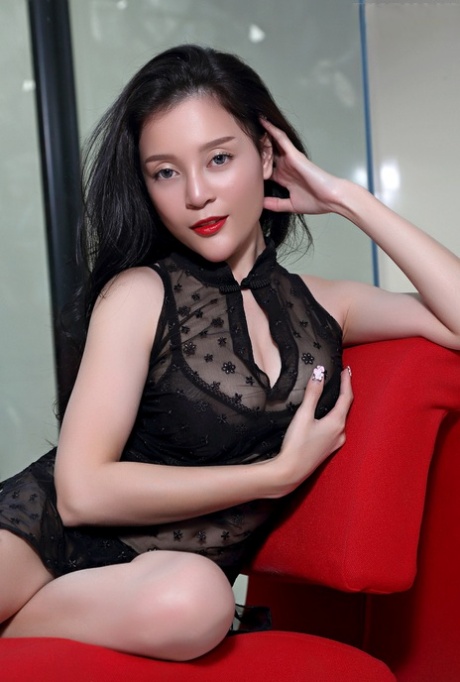 Asian babe Yogurt appears fully clothed and has red lips.