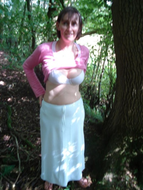 In the woods, Slut Scot Susan exposes her buttocks and gives a blowjob.