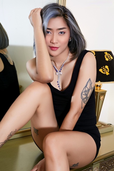 Tattooed Asian Babe Looses Her Tiny Tits And Pussy From A Little Black Dress