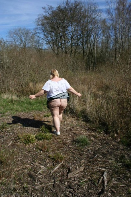 Obese: UK amateur Lexie Cummings plays tug on a couple of woodpeckers while in the wilderness.