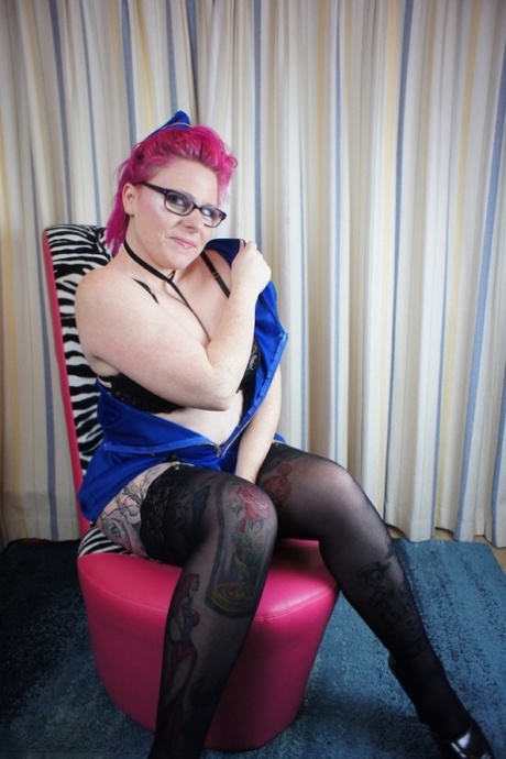 Stockings and glasses: Mollie Foxxx, an amateur model, shows off her large buttock.