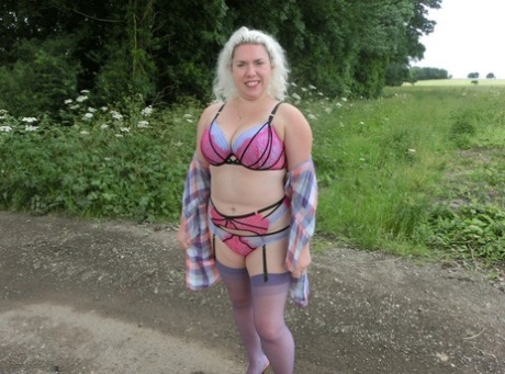 Barby, who is an older volunteer in the military, frees herself from her curvaceous appearance in a rural setting.