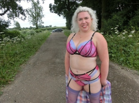 In a countryside setting, Barby's older amateur self-sufficient body is freed from the constraints of her curvy physique.