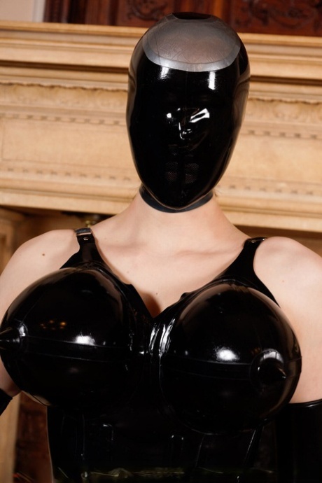 Fetish Model Dutch Dame Dons A Double-D Latex Outfit For A Solo Shoot