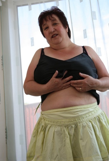 At age 12, BBW Kinky Carol has short hair and is wearing her bra and panties.