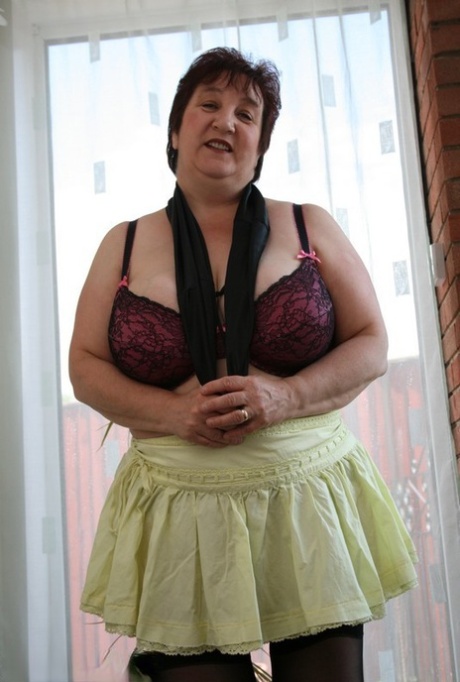 The BBW Kinky Carol is of a mature age and has short hair, but she still wears her bra and panties.