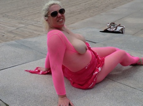 As Barby, the elderly woman loses her big tits, she is seen loosening up on an open bodysuit by the sea.