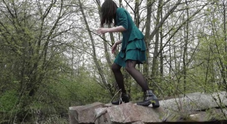 Brunette Girl Lara Pees On Concrete Blocks While Walking Railway Tracks