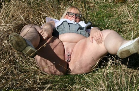 Obese: Fat UK amateur Lexie Cummings reveals her big asis and takes it in the field.