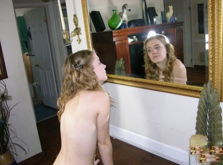 Young and unattached Dakota B dresses up and goes around her house in the nude.