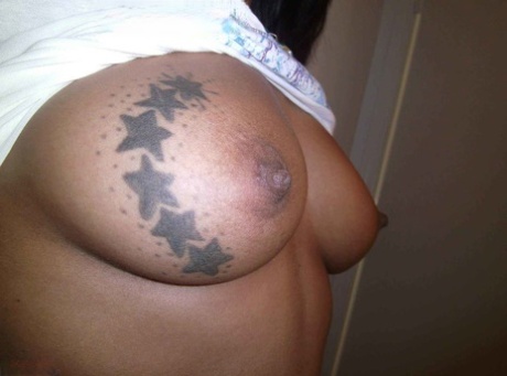 Ebony Amateur Takes Self Shots Of Her Big Tattooed Boobs And Bald Vagina