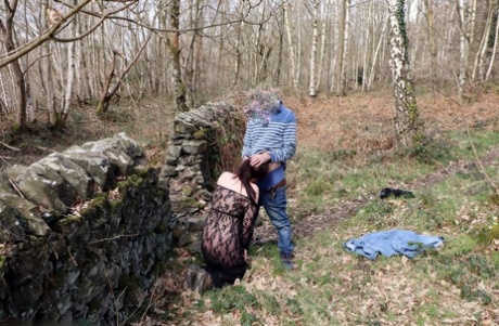 UK amateur Juicey Jane is pushed against the dry stack of stones.