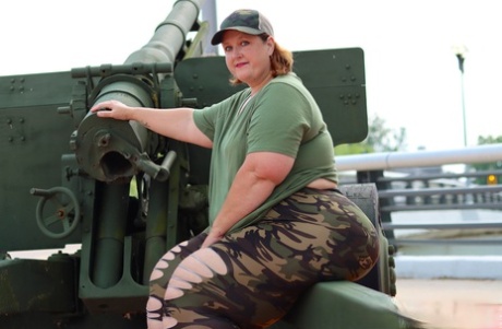 The models, all Obese Amateur-Goddess Pear, modelled an artillery gun in camouflage, for SFW shoot.