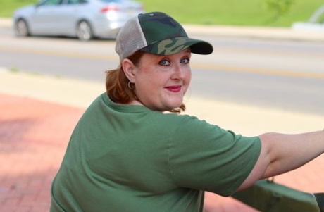 An obscenely amateur goddess pear models modelling an artillery gun in camouflage for the SFW shoot.