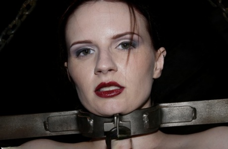 Hardcore star Claire Adams has bloody red lips during the intense bondage scene.
