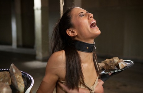 A difficult training session for a skinny brunette is completed during slave conditioning.