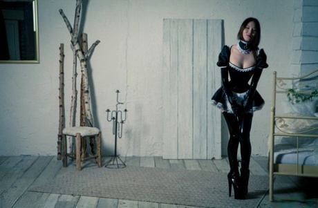 The solo shoot features a Korean model dressed in an inappropriate rubber maid costume.