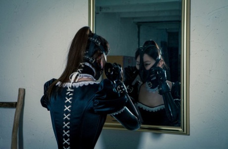 The shoot showcases a Korean model in an inappropriate rubber maid costume as they capture the moment.