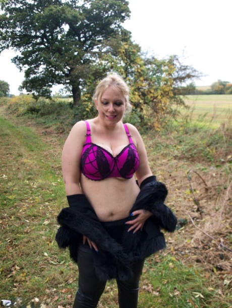 Sindy Bust, an amateur blonde, loses her large breasts while exposing herself near a farmer's field.