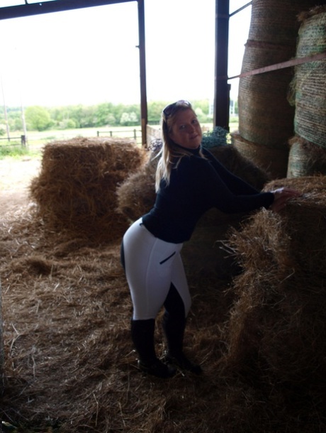 An overweight Samantha exposes herself in a hay room within the barn.