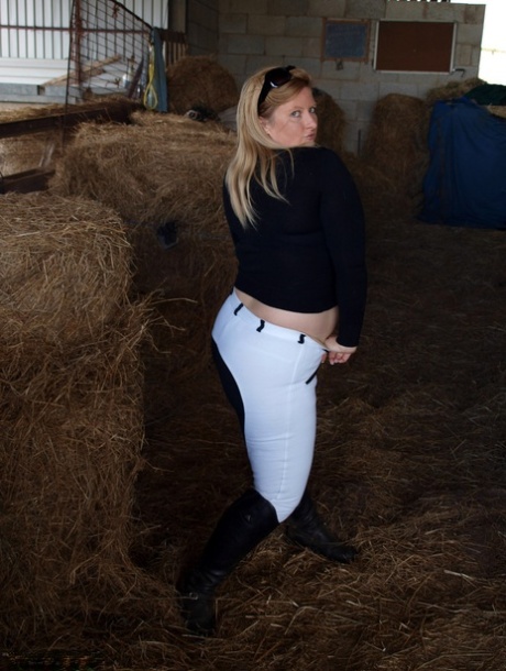 Samantha, a blonde who is overweight, exposes herself in a barn's hay room.