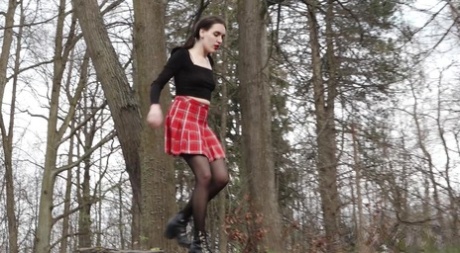 Clothed Girl Lara Hitches Up Her Skirt To Take A Piss In The Woods