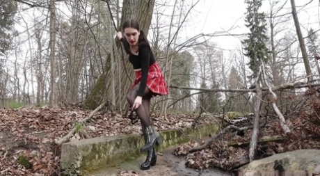 Clothed Girl Lara Hitches Up Her Skirt To Take A Piss In The Woods