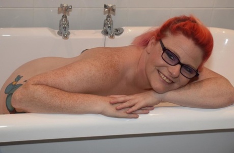 The tattooed body of Mollie Foxxx, an older woman who is also red, is being exhibited in the bathroom.